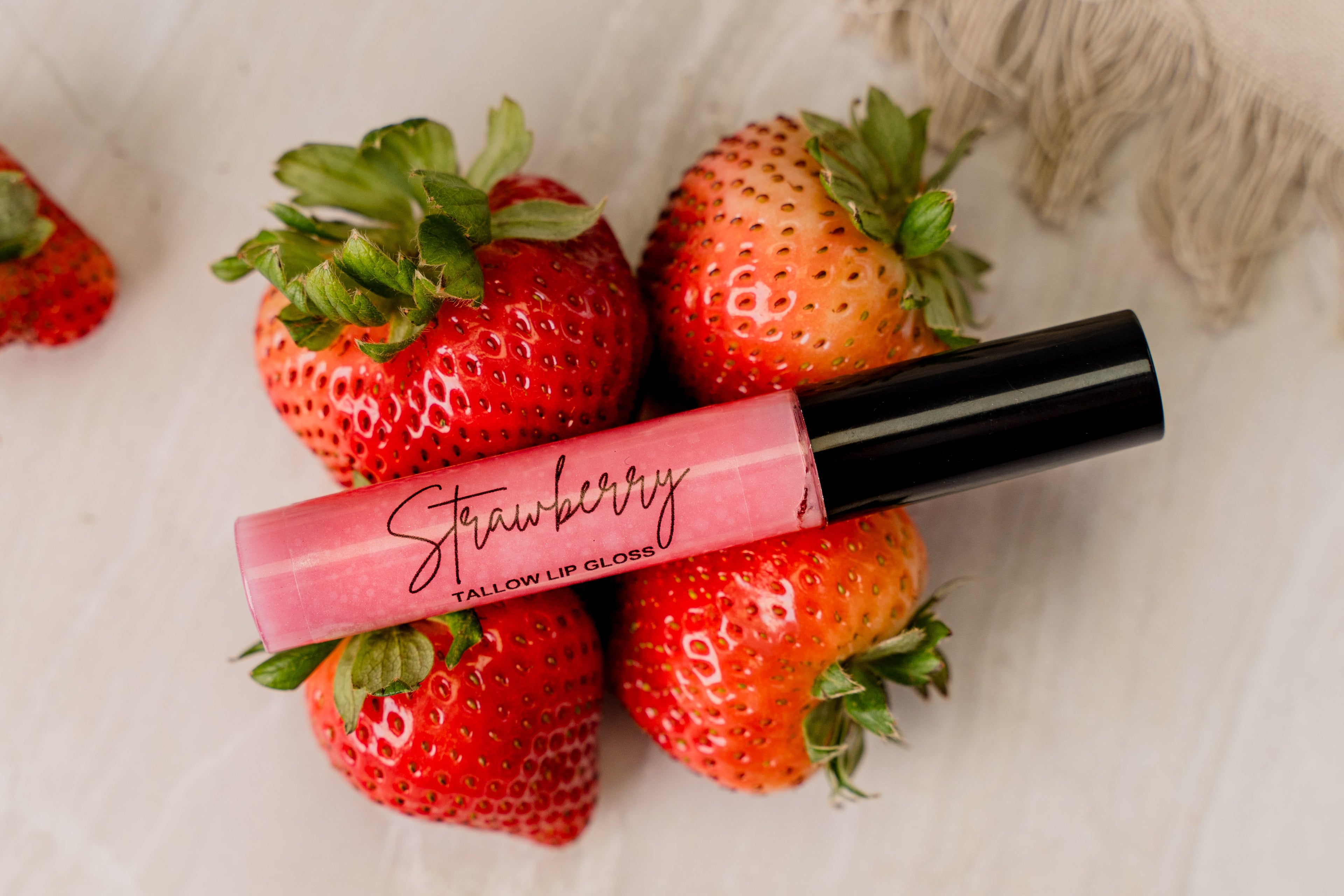 Strawberry lip gloss from Grit & Grace Tallow — a care-focused lip gloss for soft, comfortable lips